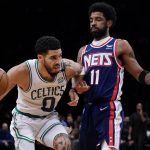 
              Boston Celtics forward Jayson Tatum (0) drives against Brooklyn Nets guard Kyrie Irving (11) during the second half of Game 4 of an NBA basketball first-round playoff series, Monday, April 25, 2022, in New York. (AP Photo/John Minchillo)
            