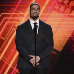 
              FILE - Roman Reigns presents the best coach award at the ESPY Awards on Wednesday, July 10, 2019, at the Microsoft Theater in Los Angeles. WWE champion Brock Lesnar takes on Universal Champion Roman Reigns in a unification bout in Sunday, April 3, 2022 Wrestlemania main event at AT&T Stadium in Arlington, Texas.     (Photo by Chris Pizzello/Invision/AP, File)
            