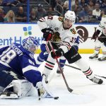 
              Tampa Bay Lightning goaltender Andrei Vasilevskiy (88) makes a save on a shot by Chicago Blackhawks center Dylan Strome (17) during the first period of an NHL hockey game Friday, April 1, 2022, in Tampa, Fla. (AP Photo/Chris O'Meara)
            