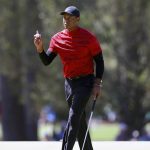 
              Tiger Woods reacts after his par putt on the third hole during the final round of the Masters golf tournament, Sunday, April 10, 2022, in Augusta, Ga. (Curtis Compton/Atlanta Journal-Constitution via AP)
            