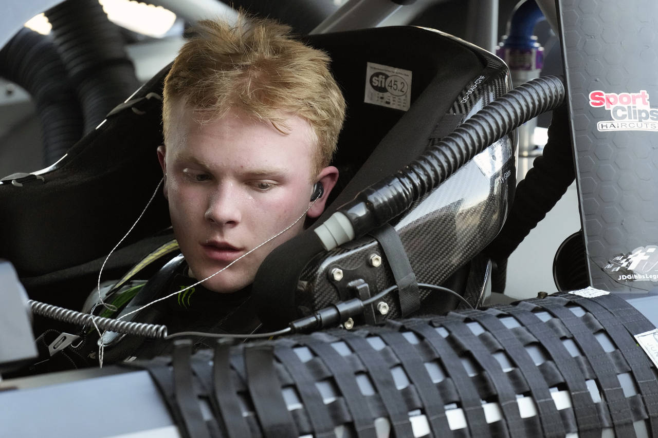 FILE - Ty Gibbs sits in his car after a NASCAR Xfinity Series auto race practice Friday, Feb. 18, 2...