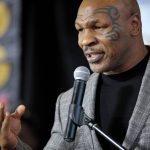 
              FILE - Former boxer Mike Tyson holds a news conference on Feb. 21, 2014, in Bethlehem, Pa. Authorities are investigating after cellphone video appears to show Mike Tyson hitting another passenger on a plane at San Francisco International Airport. (Stephen Flood/The Express-Times via AP, File)
            