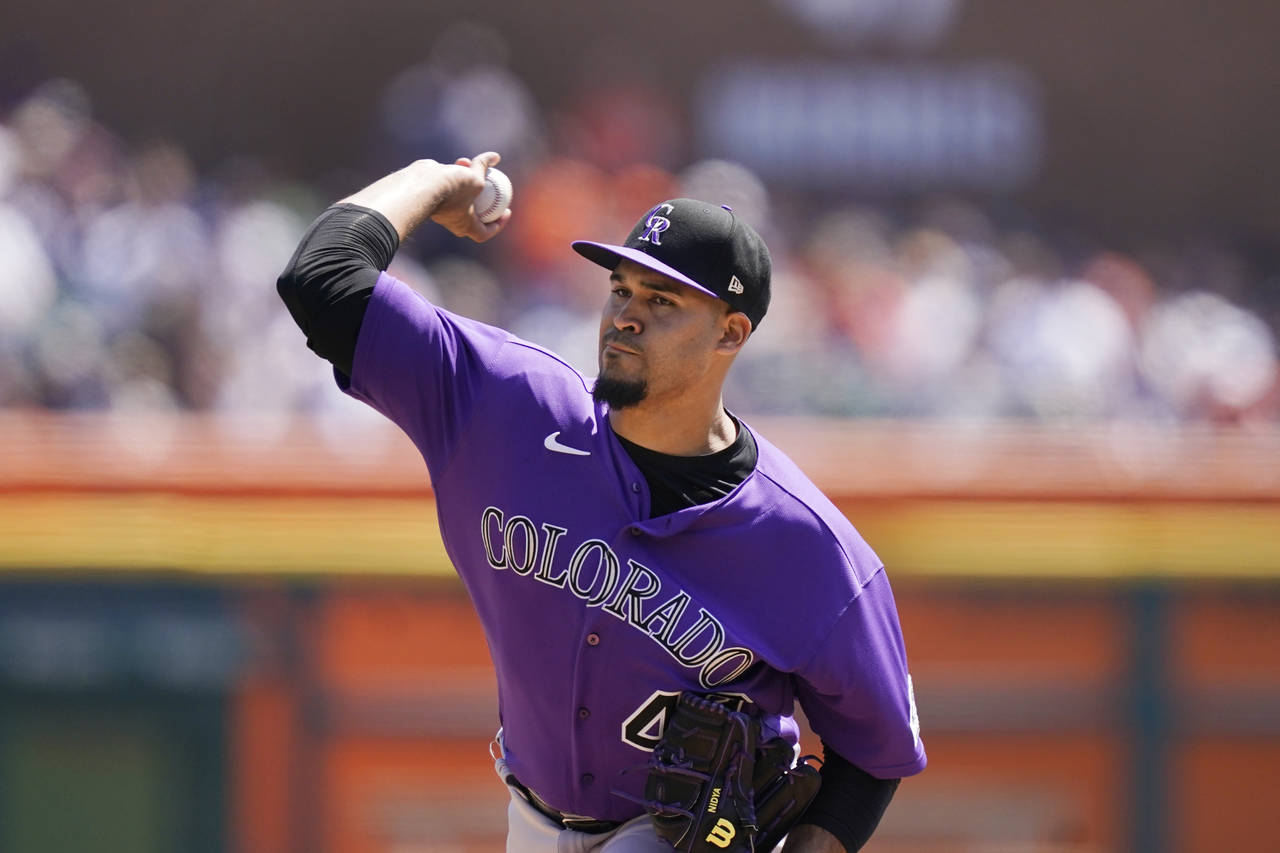 Colorado Rockies starting pitcher Antonio Senzatela throws during the first inning of the first bas...