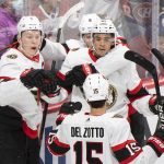 
              Ottawa Senators' Brady Tkachuk (7) celebrates with teammates after scoring against the Montreal Canadiens during the second period of an NHL hockey game in Montreal, Tuesday, April 5, 2022. (Graham Hughes/The Canadian Press via AP)
            