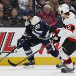 
              Columbus Blue Jackets' Oliver Bjorkstrand, left, carries the puck up ice as Ottawa Senators' Michael Del Zotto defends during the second period of an NHL hockey game Friday, April 22, 2022, in Columbus, Ohio. (AP Photo/Jay LaPrete)
            