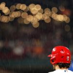 
              A steady rain falls as St. Louis Cardinals' Nolan Arenado stands on first base during the sixth inning of a baseball game against the Arizona Diamondbacks Thursday, April 28, 2022, in St. Louis. (AP Photo/Jeff Roberson)
            