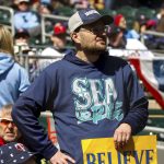 
              A Seattle Mariners fan holds up a sign reading "believe" before the Minnesota Twins home opener baseball game, Friday, April 8, 2022, in Minneapolis, Minn. (AP Photo/Nicole Neri)
            