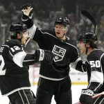 
              Los Angeles Kings center Trevor Moore, left, celebrates his goal with defenseman Olli Maatta, center, and defenseman Sean Durzi during the second period of an NHL hockey game against the Edmonton Oilers Thursday, April 7, 2022, in Los Angeles. (AP Photo/Mark J. Terrill)
            