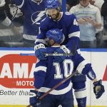 
              Tampa Bay Lightning right wing Corey Perry (10) celebrates his goal against the Buffalo Sabres with left wing Pierre-Edouard Bellemare (41) during the first period of an NHL hockey game Sunday, April 10, 2022, in Tampa, Fla. (AP Photo/Chris O'Meara)
            