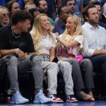 
              Olympic gymnast Nastia Liukin, second from right, jokes with Kansas City Chiefs quarterback Patrick Mahomes, second from left and his wife, Brittany Matthews, center, during the second half of Game 5 of an NBA basketball first-round playoff series, Monday, April 25, 2022, in Dallas. (AP Photo/Tony Gutierrez)
            