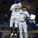 
              Milwaukee Brewers left fielder Christian Yelich (22) and Milwaukee Brewers shortstop Willy Adames (27) react after beating the Pittsburgh Pirates in a baseball game Wednesday, April 20, 2022, in Milwaukee. The Brewers won 4-2.(AP Photo/Jeffrey Phelps)
            
