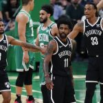 
              Brooklyn Nets' Kyrie Irving (11), Patty Mills (8) and Nic Claxton (33) stand on the court during a stoppage in play in the first half of Game 2 of the team's NBA basketball first-round Eastern Conference playoff series against the Boston Celtics, Wednesday, April 20, 2022, in Boston. (AP Photo/Michael Dwyer)
            