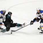 
              St. Louis Blues defenseman Nick Leddy, left, and defenseman Justin Faulk, right, compete for the puck against San Jose Sharks left wing Rudolfs Balcers (92) during the second period of an NHL hockey game in San Jose, Calif., Thursday, April 21, 2022. (AP Photo/Josie Lepe)
            