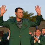 
              Scottie Scheffler celebrates after putting on the green jacket after winning the 86th Masters golf tournament on Sunday, April 10, 2022, in Augusta, Ga. (AP Photo/David J. Phillip)
            