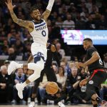 
              Minnesota Timberwolves guard D'Angelo Russell (0) loses control of the ball while Los Angeles Clippers forward Norman Powell (24) defends during the first quarter during an NBA basketball game Tuesday, April 12, 2022, in Minneapolis. (AP Photo/Andy Clayton-King)
            