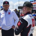 
              FILE - Joe Gibbs, left, talks things over with his grandson, Ty Gibbs, right, prior to a NASCAR Xfinity Series auto race at Dover International Speedway, Saturday, May 15, 2021, in Dover, Del. A week off might have been just what Ty Gibbs needed after consecutive races drew criticism for his aggressive driving and then a post-race fight with a rival. Now the 19-year-old grandson of Joe Gibbs heads to Talladega Superspeedway hoping to clear the slate. (AP Photo/Chris Szagola, File)
            
