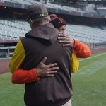 
              San Diego Padres third base coach Mike Shildt, back to camera, hugs San Francisco Giants first base coach Antoan Richardson after they spoke at a news conference before a baseball game in San Francisco, Wednesday, April 13, 2022. (AP Photo/Jeff Chiu)
            