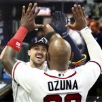 
              Atlanta Braves' Adam Duvall celebrates his two-run home run with Marcell Ozuna during the eighth inning of the team's baseball game against the Chicago Cubs on Thursday, April 28, 2022, in Atlanta. (Curtis Compton/Atlanta Journal-Constitution via AP)
            