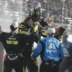 
              William Byron is swarmed by his pit crew after he won the NASCAR Cup Series auto race at Martinsville Speedway on Saturday, April 9, 2022, in Martinsville, Va. (AP Photo/Steve Helber)
            