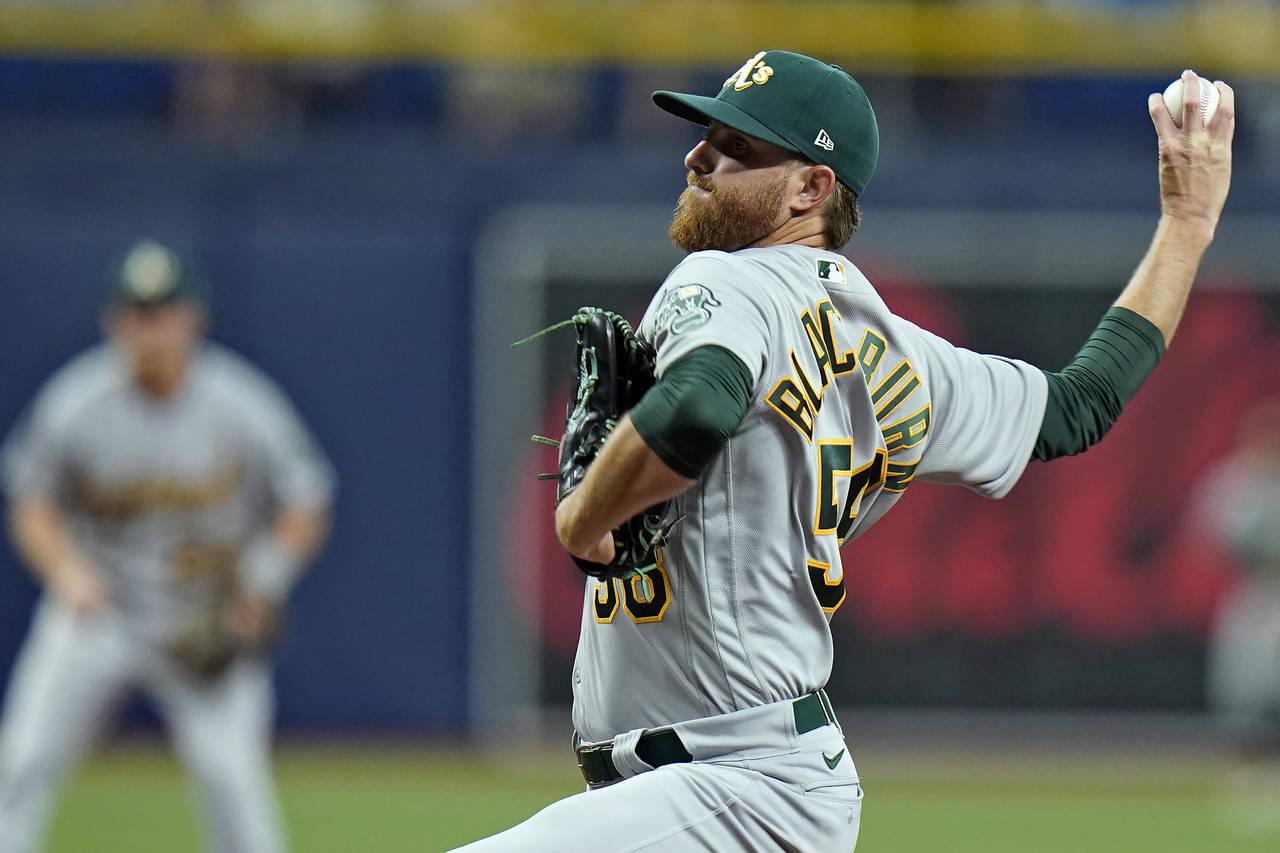 Oakland Athletics starting pitcher Paul Blackburn delivers to the Tampa Bay Rays during the second ...