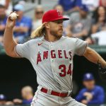 
              Los Angeles Angels starting pitcher Noah Syndergaard (34) delivers in the first inning against the Texas Rangers during a baseball game on Saturday, April 16, 2022, in Arlington, Texas. (AP Photo/Richard W. Rodriguez)
            