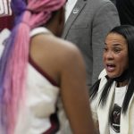 
              South Carolina head coach Dawn Staley talks to players during the first half of a college basketball game in the semifinal round of the Women's Final Four NCAA tournament Friday, April 1, 2022, in Minneapolis. (AP Photo/Eric Gay)
            