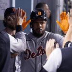 
              Detroit Tigers' Jeimer Candelario is congratulated by teammates in the dugout after scoring on a double by Javier Baez during the seventh inning of a baseball game against the Los Angeles Dodgers Saturday, April 30, 2022, in Los Angeles. (AP Photo/Mark J. Terrill)
            