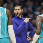 
              Charlotte Hornets head coach James Borrego, center, gives instruction to Charlotte Hornets center Montrezl Harrell (8) and guard Terry Rozier (3) during the first half of an NBA basketball game against the Orlando Magic on Thursday, April 7, 2022, in Charlotte, N.C. (AP Photo/Rusty Jones)
            