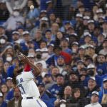 
              Toronto Blue Jays first baseman Vladimir Guerrero Jr. catches an infield popup for the out on Texas Rangers' Andy Ibanez during the fifth inning of a baseball game Friday, April 8, 2022, in Toronto. (Nathan Denette/The Canadian Press via AP)
            