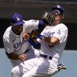 
              Los Angeles Dodgers left fielder Chris Taylor, left, collides with shortstop Trea Turner after catching a fly ball hit by Cincinnati Reds' Jake Fraley during the third inning of a baseball game Sunday, April 17, 2022, in Los Angeles. (AP Photo/Mark J. Terrill)
            