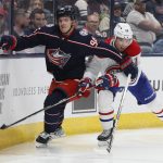 
              Columbus Blue Jackets' Jack Roslovic, left, and Montreal Canadiens' Nick Suzuki chase the puck during the third period of an NHL hockey game Wednesday, April 13, 2022, in Columbus, Ohio. (AP Photo/Jay LaPrete)
            