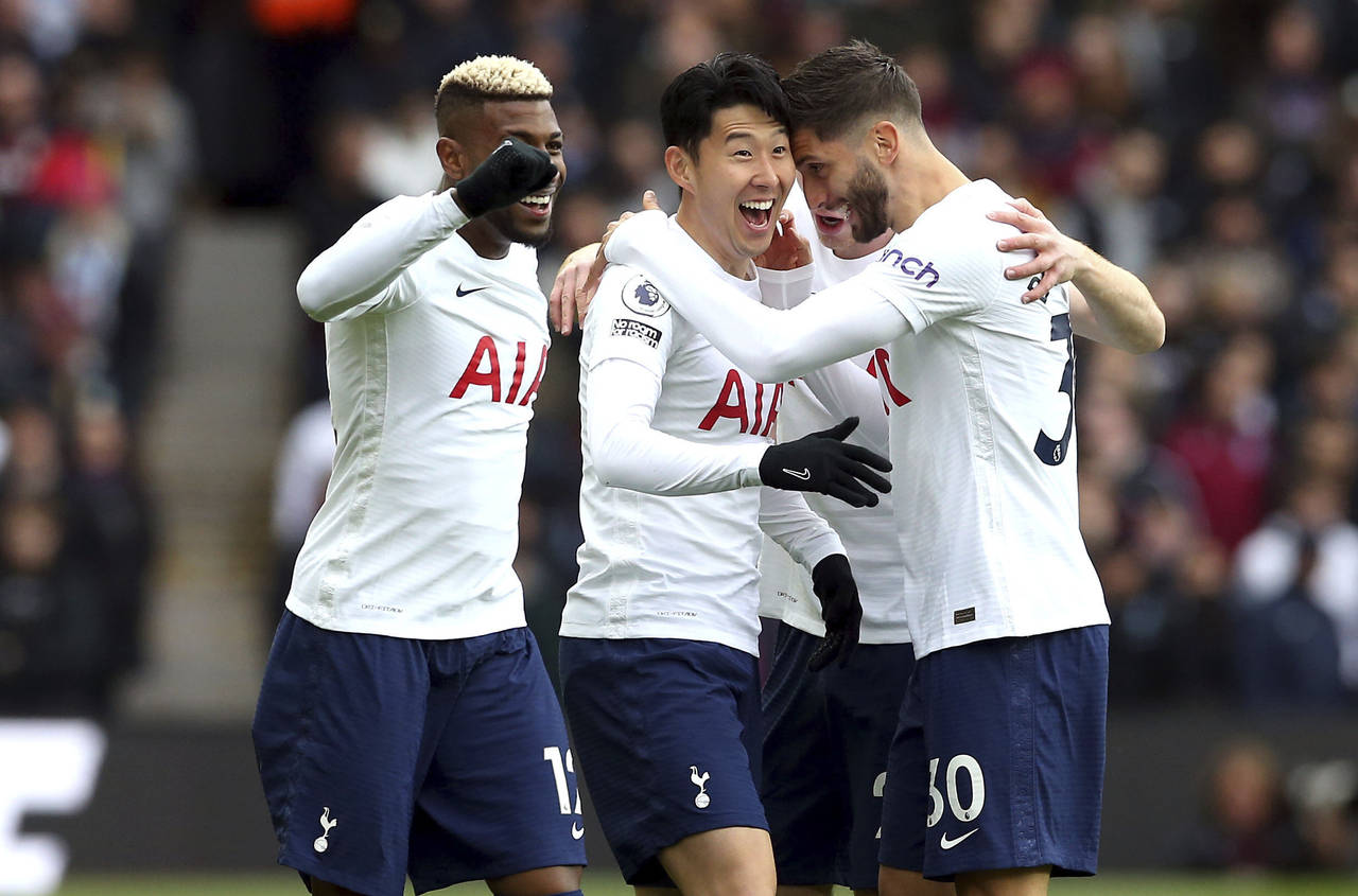 Tottenham Hotspur's Son Heung-min, center, celebrates scoring during the English Premier League soc...