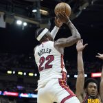 
              Miami Heat forward Jimmy Butler (22) shoots as Atlanta Hawks forward De'Andre Hunter defends during the first half of Game 2 of an NBA basketball first-round playoff series, Tuesday, April 19, 2022, in Miami. (AP Photo/Lynne Sladky)
            
