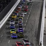 
              Chase Elliott leads the field at the start of the NASCAR Cup Series auto race at Martinsville Speedway on Saturday, April 9, 2022, in Martinsville, Va. (AP Photo/Steve Helber)
            