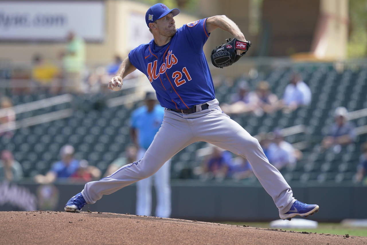 New York Mets' Max Scherzer pitches in the first inning of a spring training baseball game against ...