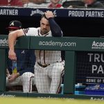 
              Atlanta Braves outfielder Adam Duvall watches from the dugout during a baseball game against the Washington Nationals, Monday, April 11, 2022, in Atlanta. (AP Photo/John Bazemore)
            