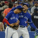 
              Toronto Blue Jays center fielder George Springer, right, and second baseman Gosuke Katoh celebrate after the top of the fourth inning against the Boston Red Sox in a baseball game Wednesday, April 27, 2022, in Toronto. (Christopher Katsarov/The Canadian Press via AP)
            