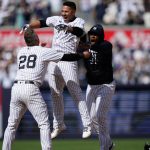 
              New York Yankees' Gleyber Torres, center, celebrates with Josh Donaldson after driving in the game winning run during the ninth inning a baseball game against the Cleveland Guardians Saturday, April 23, 2022, in New York. The Yankees won 5-4. (AP Photo/Frank Franklin II)
            
