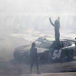 
              Ty Gibbs, center top, celebrates after winning a NASCAR Xfinity Series auto race at Richmond Raceway, Saturday, April 2, 2022, in Richmond, Va. (James H. Wallace/Richmond Times-Dispatch via AP)
            