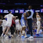 
              North Carolina guard Caleb Love reacts to a loss against Kansas after a college basketball game in the finals of the Men's Final Four NCAA tournament, Monday, April 4, 2022, in New Orleans. Kansas won 72-69. (AP Photo/David J. Phillip)
            
