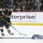 
              Vancouver Canucks defenseman Luke Schenn (2) slides to the ice to try to block a shot by Minnesota Wild left wing Kevin Fiala (22) during the first period of an NHL hockey game Thursday, April 21, 2022, in St. Paul, Minn. (Aaron Lavinsky/Star Tribune via AP)
            
