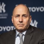 
              FILE -Yankees general manager Brian Cashman listens as Gerrit Cole is introduced as the newest New York Yankees player during a baseball media availability, Wednesday, Dec. 18, 2019 in New York. The New York Yankees were fined $100,000 by baseball Commissioner Rob Manfred for using their dugout phone to relay information about opposing teams’ signs during the 2015 season and part of 2016. The fine was disclosed in a Sept. 14, 2017, letter from Manfred to Yankees general manager Brian Cashman that is set to be unsealed in U.S. District Court in New York this week as part of a dismissed lawsuit by a fan. (AP Photo/Mark Lennihan, File)
            