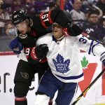 
              Ottawa Senators right wing Drake Batherson (19) wraps up Toronto Maple Leafs defenseman Timothy Liljegren (37) during the second period of an NHL hockey game in Ottawa, Ontario, Saturday, April 16, 2022. (Justin Tang/The Canadian Press via AP)
            