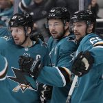 
              San Jose Sharks center Tomas Hertl, center, is congratulated by Logan Couture, left, and Erik Karlsson, right, after scoring a goal against the Edmonton Oilers during the first period of an NHL hockey game Tuesday, April 5, 2022, in San Jose, Calif. (AP Photo/Tony Avelar)
            