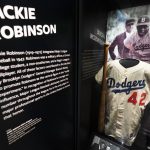 
              A jersey of Jackie Robinson is displayed at the National Museum of African American History and Culture in Washington, commemorating the 75th anniversary of Jackie Robinson's integration of Major League Baseball, Thursday, April 7, 2022. Robinson became the first African American to play in Major League Baseball breaking the baseball color barrier on April 15, 1947, when he started at first base for the Brooklyn Dodgers. (AP Photo/Manuel Balce Ceneta)
            