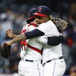 
              Cleveland Guardians relief pitcher Emmanuel Clase, right, and catcher Austin Hedges celebrate the team's 2-1 victory over the Chicago White Sox in the second game of a baseball doubleheader, Wednesday, April 20, 2022, in Cleveland. (AP Photo/Ron Schwane)
            