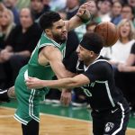 
              Brooklyn Nets' Seth Curry, right, commits a flagrant foul on Boston Celtics' Jayson Tatum during the first half of Game 2 of an NBA basketball first-round Eastern Conference playoff series Wednesday, April 20, 2022, in Boston. (AP Photo/Michael Dwyer)
            