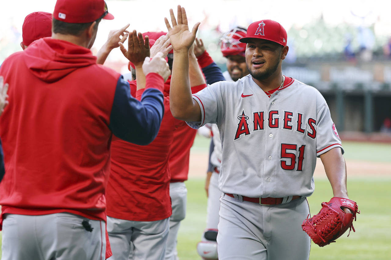 Los Angeles Angels pitcher Jaime Barria (51) celebrates with the team after the win over the Texas ...