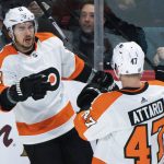 
              Philadelphia Flyers' Travis Konecny (11) celebrates with Ronnie Attard (47) after scoring against the Montreal Canadiens during the second period of an NHL hockey game Thursday, April 21, 2022, in Montreal. (Graham Hughes/The Canadian Press via AP)
            