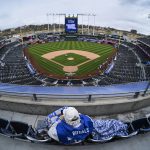 
              One Kansas City Royals fan arrived early with plenty of cold-weather gear for the home opener against the Cleveland Guardians before the start of a baseball game, Thursday, April 7, 2022 in Kansas City, Mo. (AP Photo/Reed Hoffmann)
            
